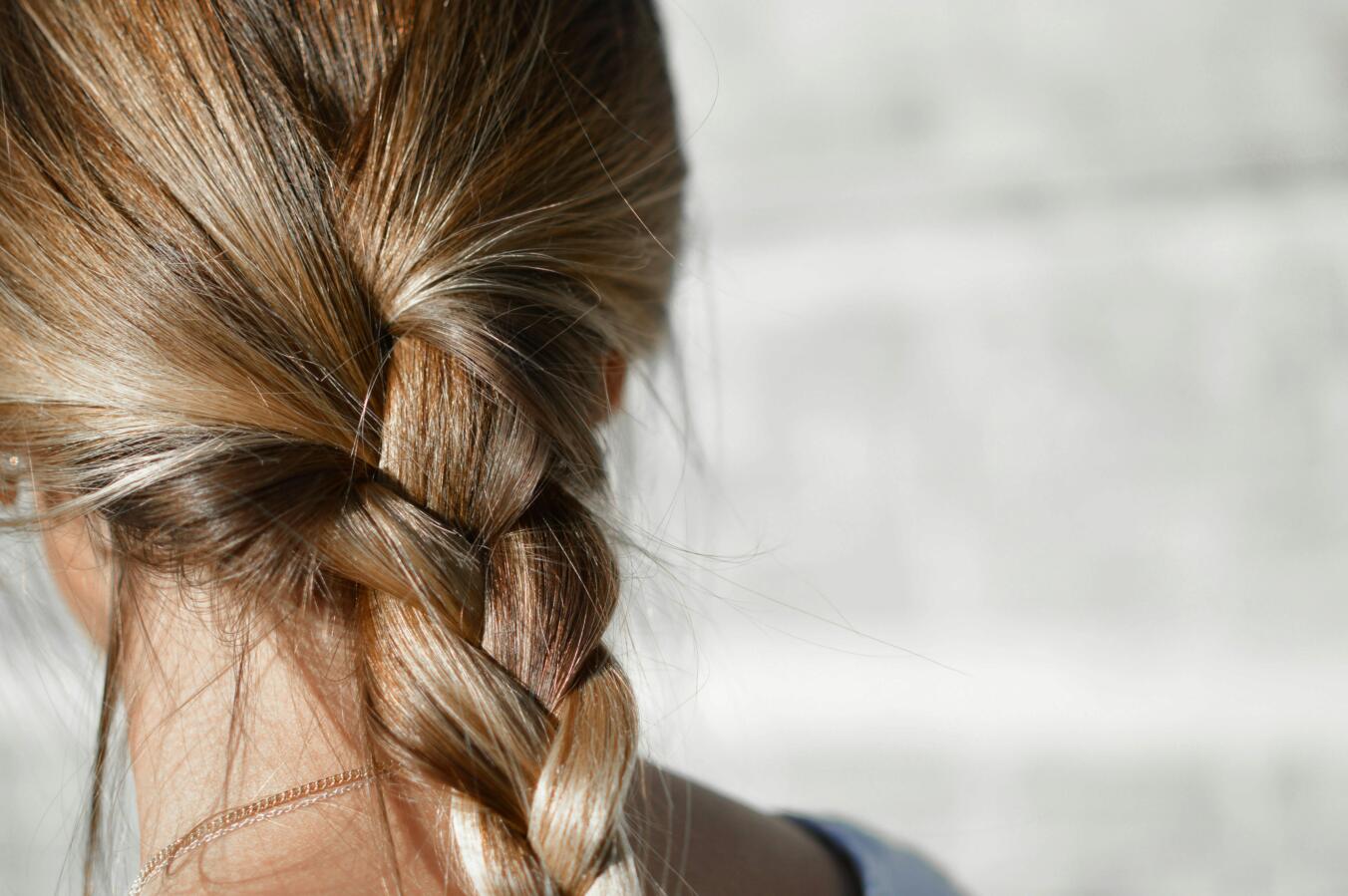 Close up of women's blonde plaited hair
