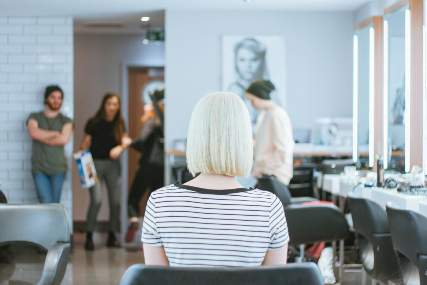 Woman with icy blonde hair at a salon