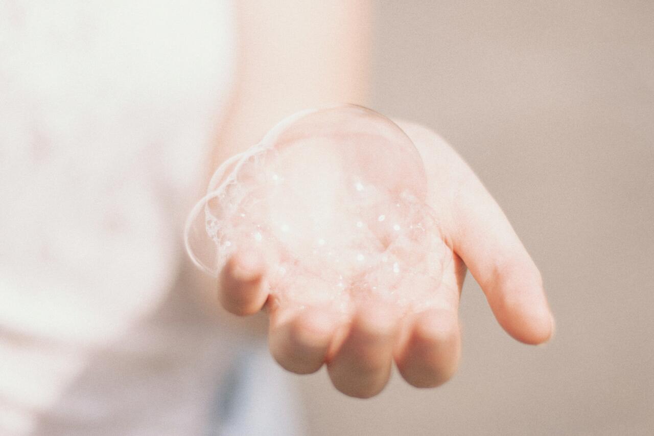 Woman holding a soap bubble