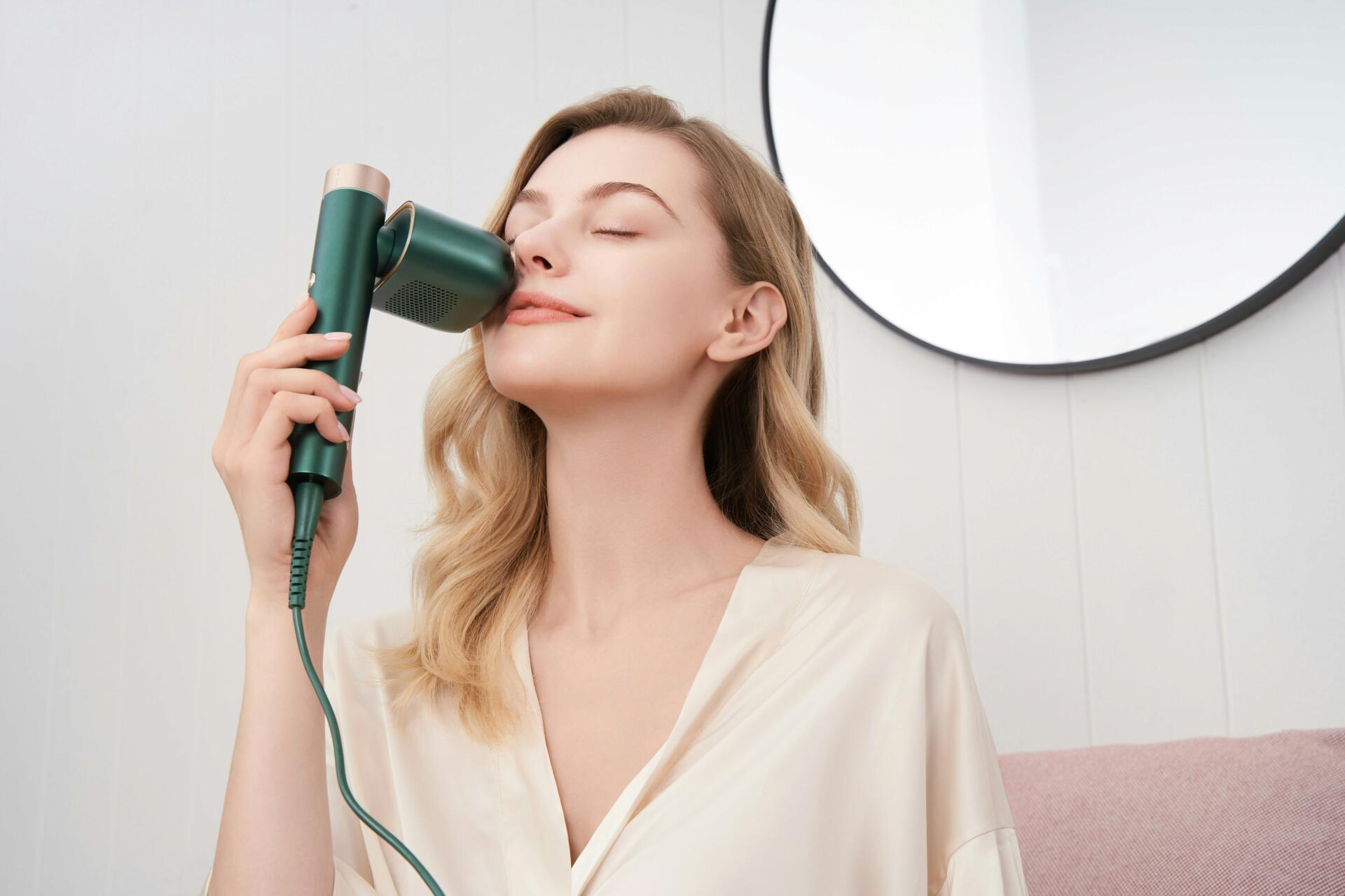 Woman using heat styling tool 