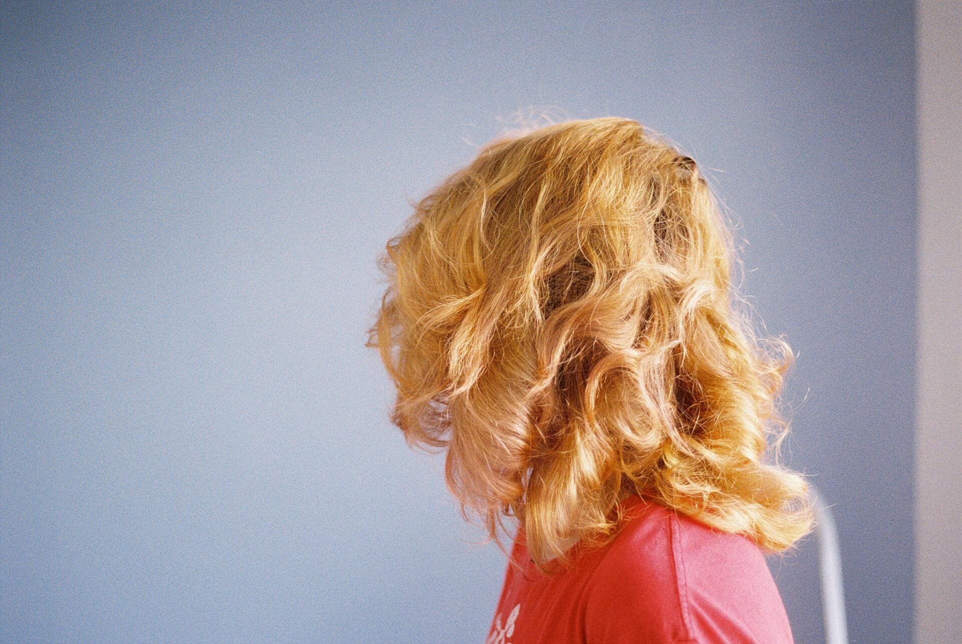 Woman with frizzy blonde hair