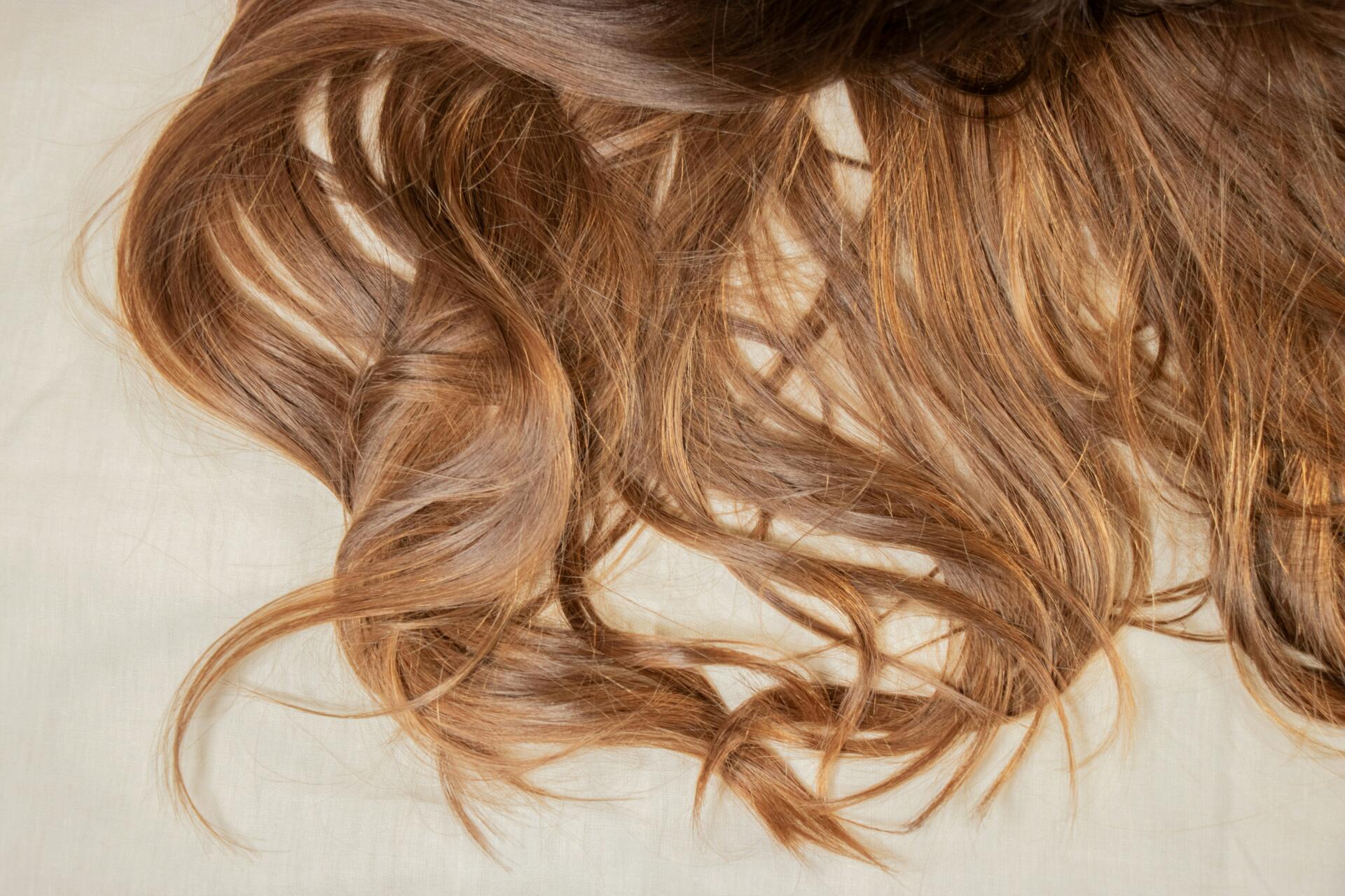 Long coppery blonde hair splayed out