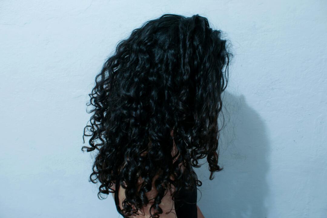 Woman with thick, dark curly hair