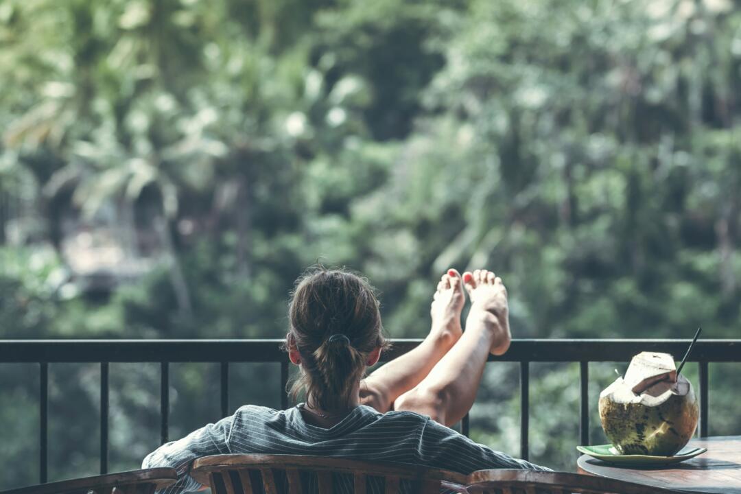Young woman relaxing on a balcony