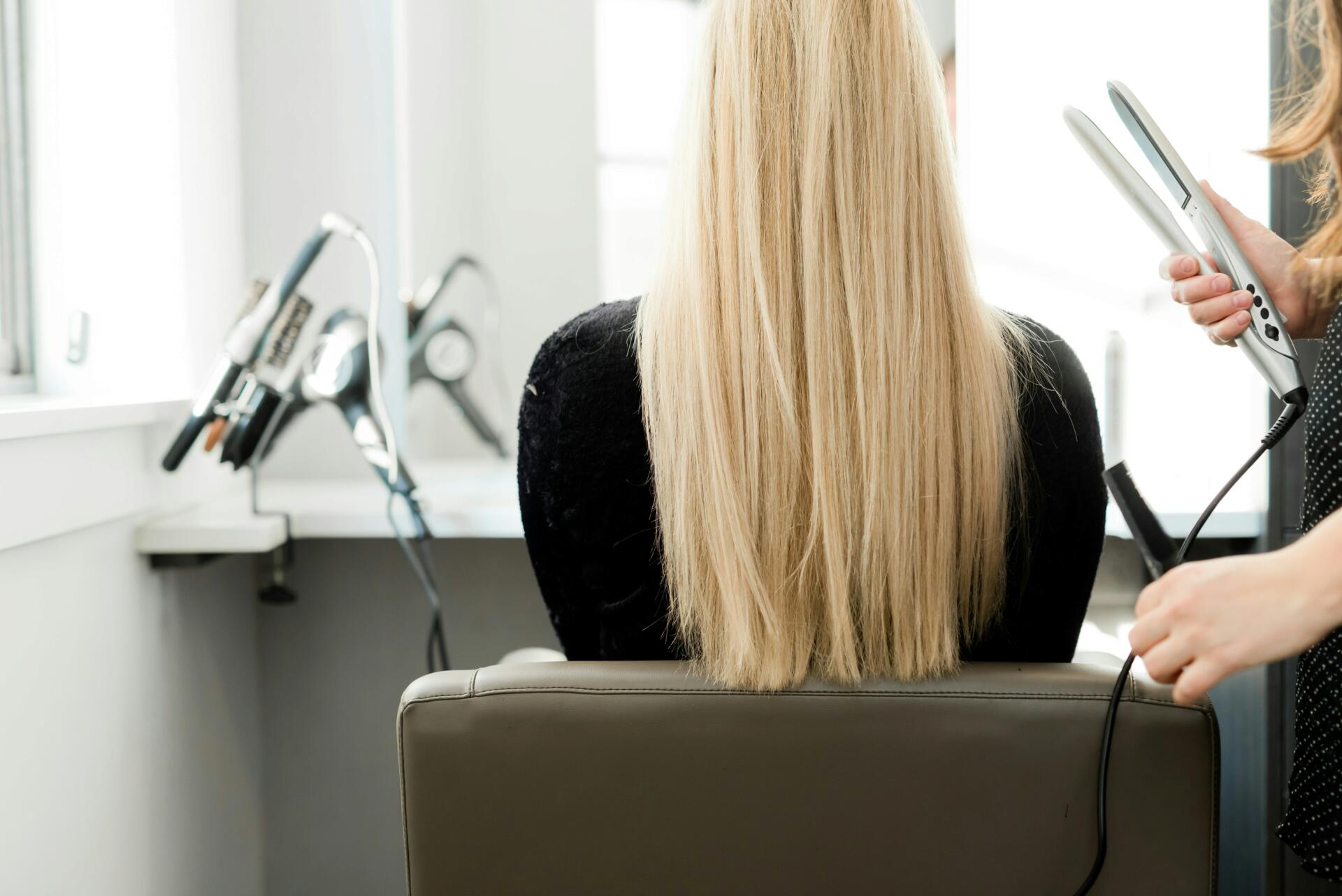 Woman with long blonde hair at salon