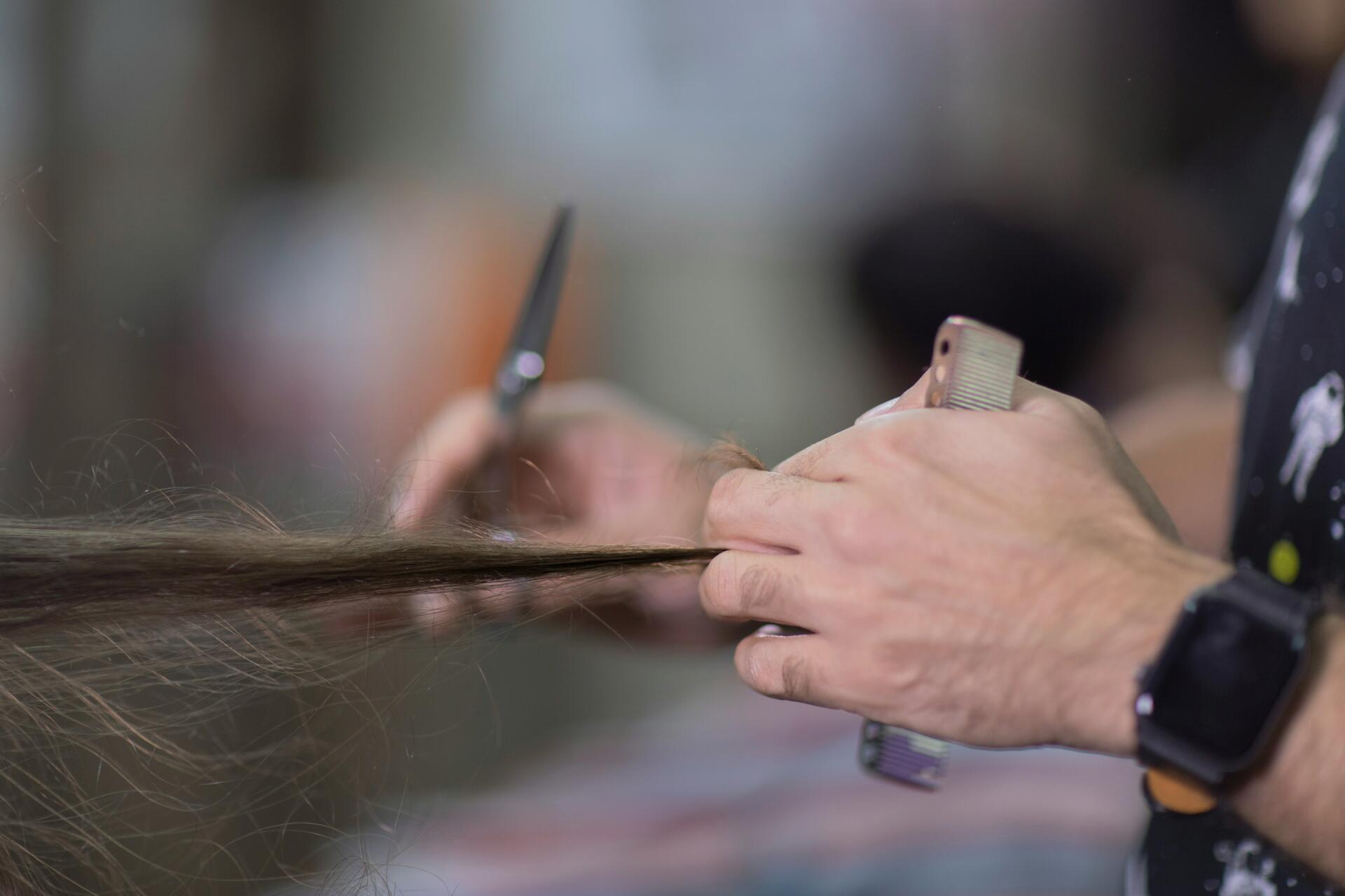 Stylist trimming split ends
