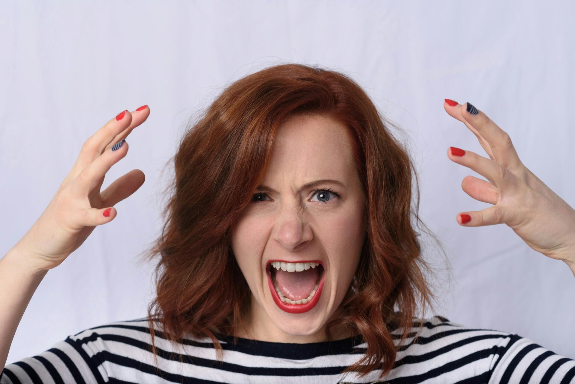 Young woman frustrated with hair loss and thinning