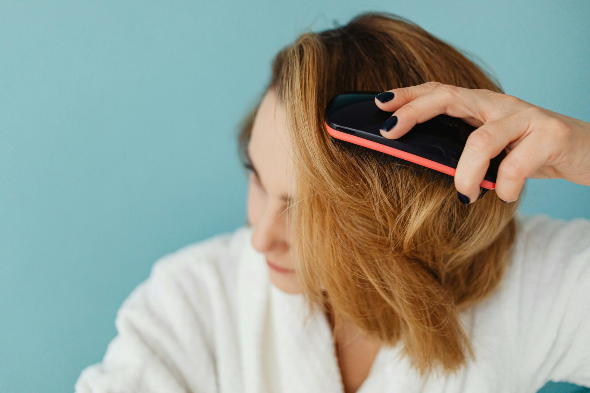 Woman brushing her hair
