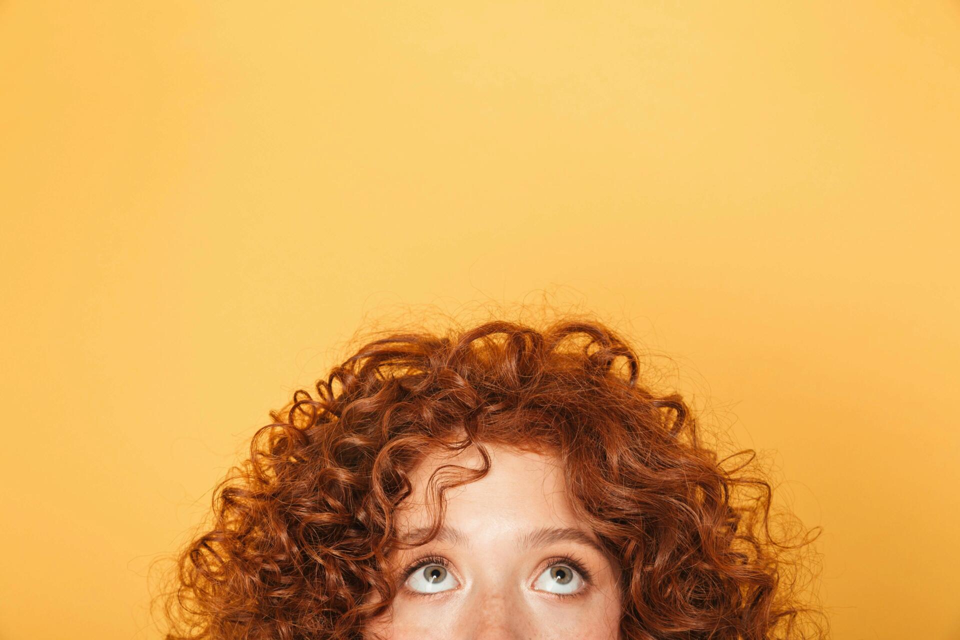 Woman with red curly hair