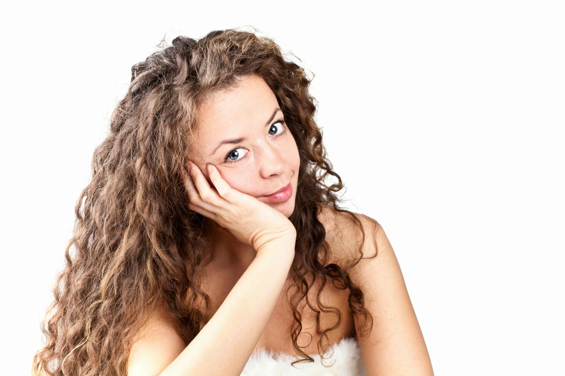 Young woman with long curly hair